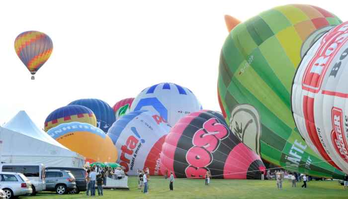 Alabama jubilee decatur air balloonists spectators inflate mingle